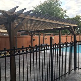 Whitfield Home Improvements: pergola and metal pool-side fence