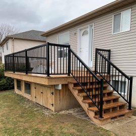 Whitfield Home Improvements: new wood deck with metal railing