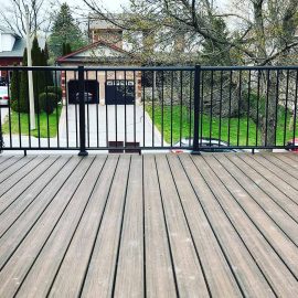 Whitfield Home Improvements: second story walk out deck renovation with metal railing