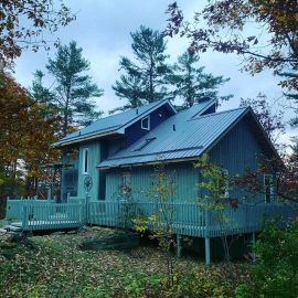 Whitfield Home Improvements - home renovation completed - new steel roof, trim, deck railing and repairs