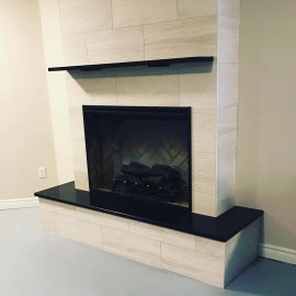 Whitfield Home Improvements - new tile gas fireplace with hearth and mantle
