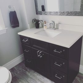 Whitfield Home Improvements: bathroom renovation complete - beautiful dark wood sink cabinet