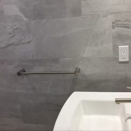 Whitfield Home Improvements: dark gray tile bathroom renovation complete