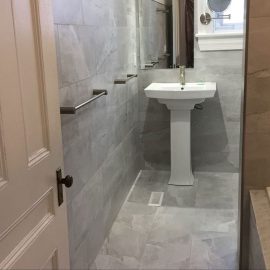 Whitfield Home Improvements: dark gray tile bathroom renovation complete