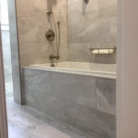 Whitfield Home Improvements: dark gray tile bathroom renovation complete