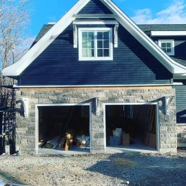 Whitfield Home Improvements - new home construction - double car garage, shiplap siding and stone facade