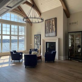 Beautiful vaulted ceiling with large glass windows overlooking the lake.